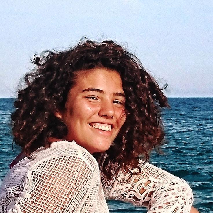 Kaveri Mehta, Lead Design Curator at Perche Vening Zephyr, reviewing corporate floral arrangements